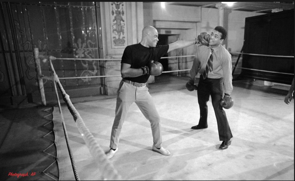 James Earl Jones lands one on Muhammed Ali. Taken in Hollywood, 1969